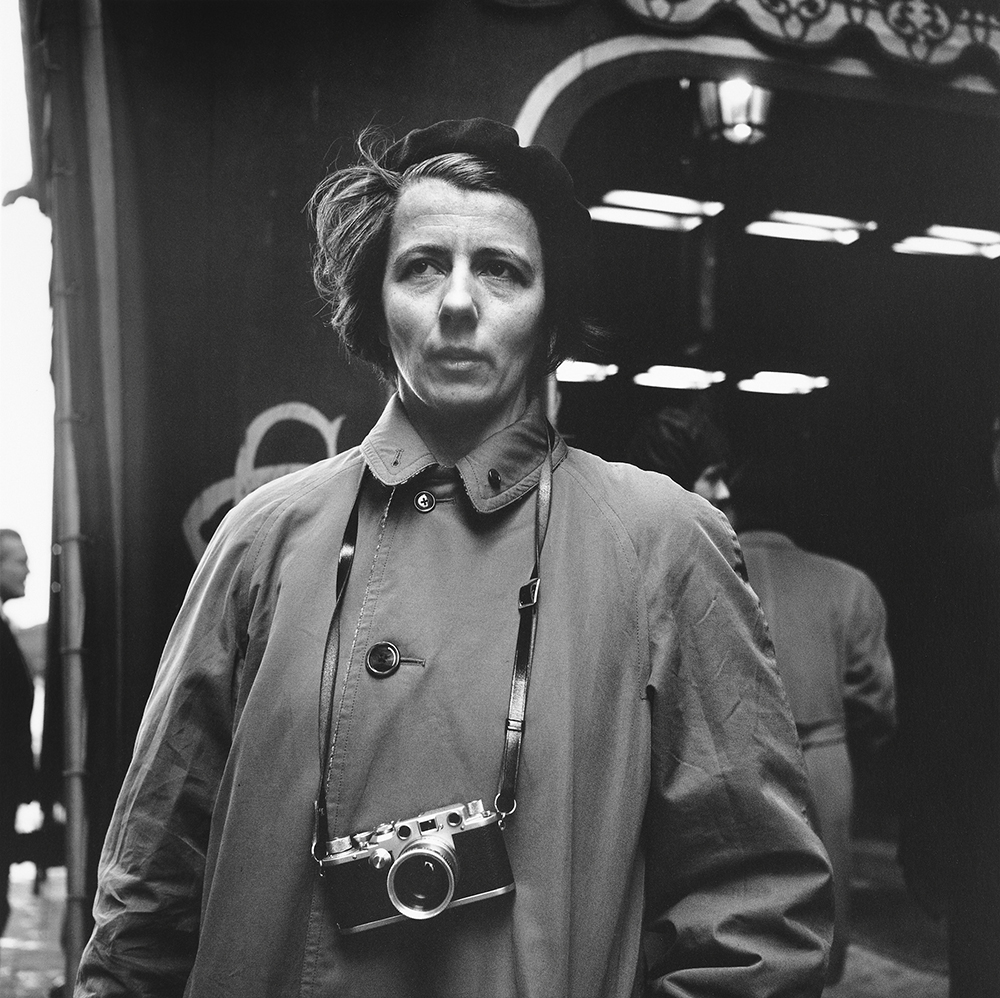 Vivian Maier poses for a black and white photo